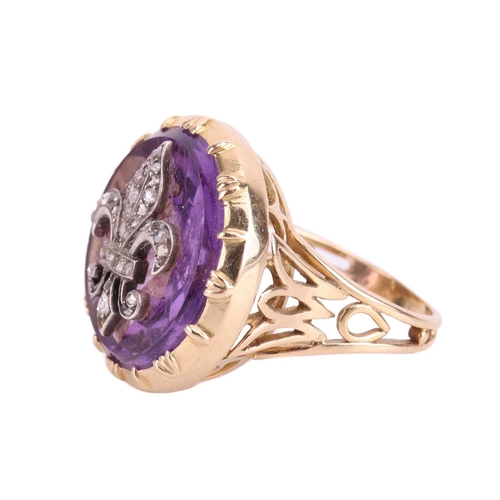 114 - An amethyst fleur-de-lis cocktail ring, the fleur-de-lis emblem set with rose cut diamonds and mount... 