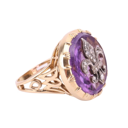 114 - An amethyst fleur-de-lis cocktail ring, the fleur-de-lis emblem set with rose cut diamonds and mount... 