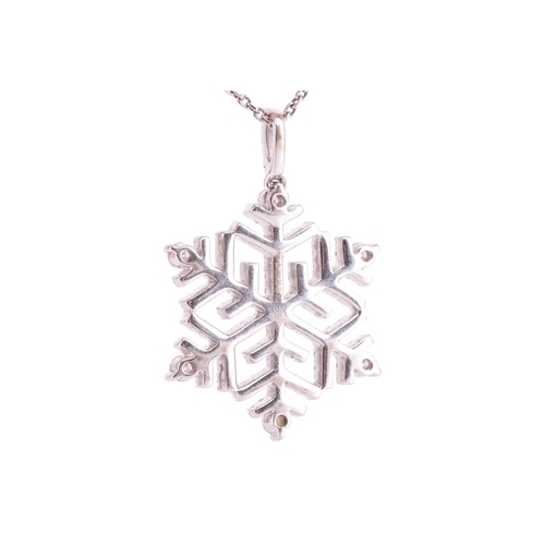 132 - A diamond snowflake pendant, set throughout with round brilliant cut diamonds, with a total estimate... 