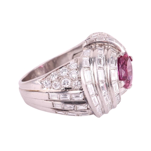 138 - A pink sapphire and diamond cocktail ring of knot design, circa 1960s, centred with a navette-shaped... 