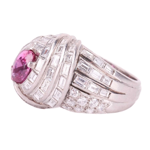 138 - A pink sapphire and diamond cocktail ring of knot design, circa 1960s, centred with a navette-shaped... 