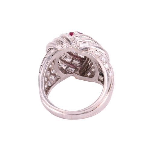 138 - A pink sapphire and diamond cocktail ring of knot design, circa 1960s, centred with a navette-shaped... 