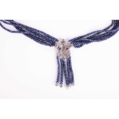 139 - An Art Deco style beaded sapphire and diamond sautoir necklace, composed of five strands of faceted ... 