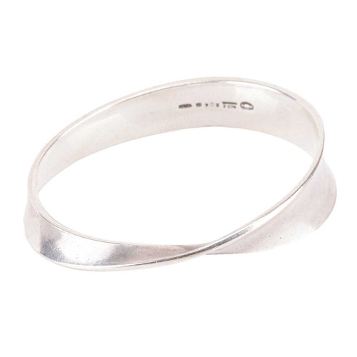 143 - Georg Jensen - a 'Möbius' closed bangle, constructed with a tapering and slightly concave strip, des... 