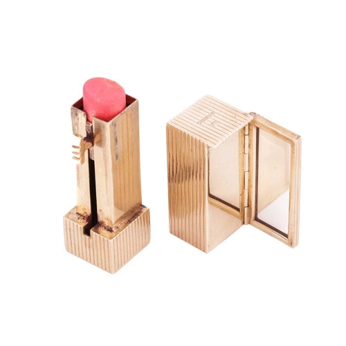 145 - Kurt Weiss - a lipstick holder with mirror in 9ct yellow gold, of reeded rectangular prism form, the... 