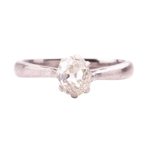 15 - An old-cut diamond solitaire ring, coronet-set with an oval old-cut diamond of tinted yellow colour,... 