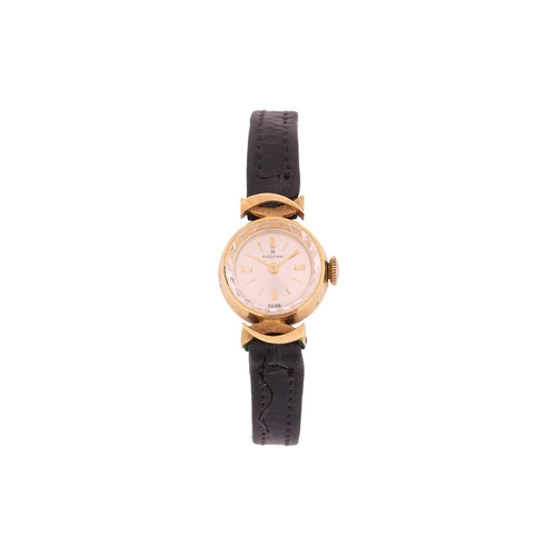 151 - An 18ct gold Hugeunin Lady's dress watch, featuring a mechanical movement in a yellow metal case mea... 