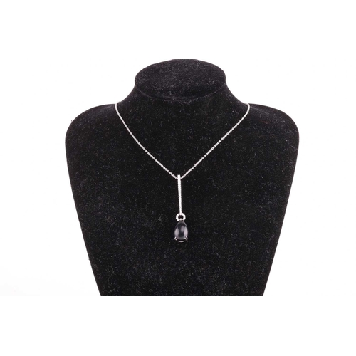 17 - A Whitby jet and diamond drop pendant on chain, featuring a teardrop-shaped jet cabochon of 13.0 x 9... 