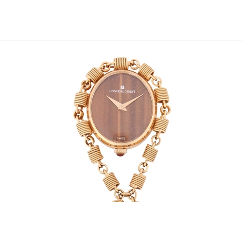 170 - A pendant watch with a tiger's eye dial, circa 1970, of oval form approximately measuring 25.0 x 22.... 