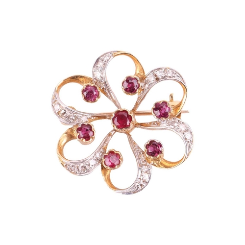 18 - A ruby and diamond brooch, designed as a stylised flower set with rubies, with single cut diamonds s... 