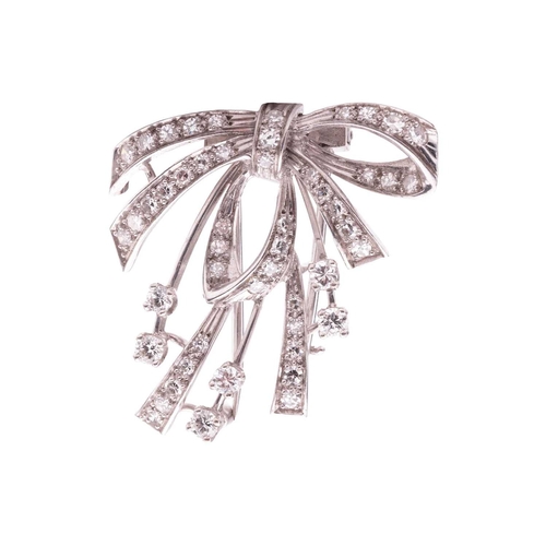 20 - A diamond-set bow dress clip/brooch, the central bow and ribbons claw-set with single-cut diamonds, ... 