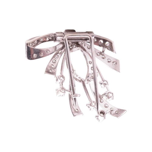 20 - A diamond-set bow dress clip/brooch, the central bow and ribbons claw-set with single-cut diamonds, ... 