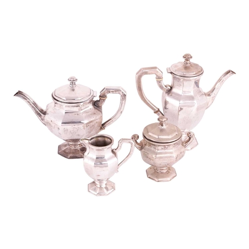 215 - An Art Deco tea service, comprising a teapot, coffee pot, tea caddy and milk jug, each piece of angu... 