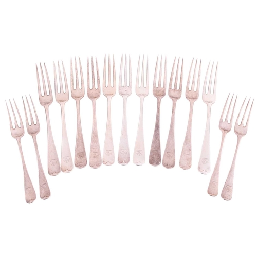 217 - A collection of silver flatware comprising a set of eleven two-pronged table forks and four two-pron... 