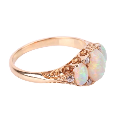 25 - An opal and diamond half-hoop ring, featuring three graduated oval cabochons, displaying spectral pl... 