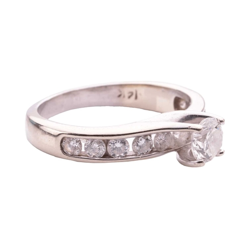 27 - A diamond solitaire ring, the central round brilliant diamond measuring approximately 4.85mm, with a... 