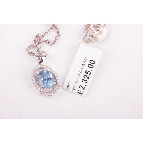 28 - An aquamarine and diamond-set oval pendant, featuring an oval aquamarine, with an estimated carat we... 