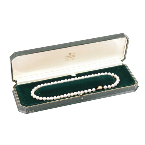 29 - A cultured pearl necklace with diamond-set clasp, comprising a row of unified round cultured pearls,... 