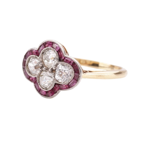 30 - An Art Deco diamond and ruby quatrefoil ring, the panel is constructed by four old-cut diamonds with... 