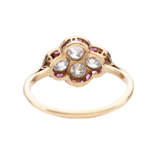 30 - An Art Deco diamond and ruby quatrefoil ring, the panel is constructed by four old-cut diamonds with... 