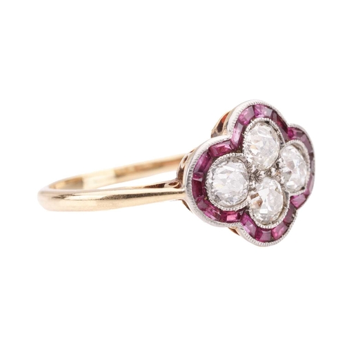 30 - An Art Deco diamond and ruby quatrefoil ring, the panel is constructed by four old-cut diamonds with... 