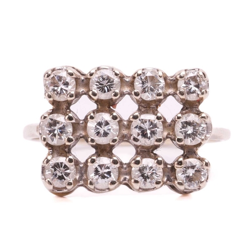 31 - A diamond ring set with a triple row of round brilliant-cut diamonds, with a total estimated weight ... 