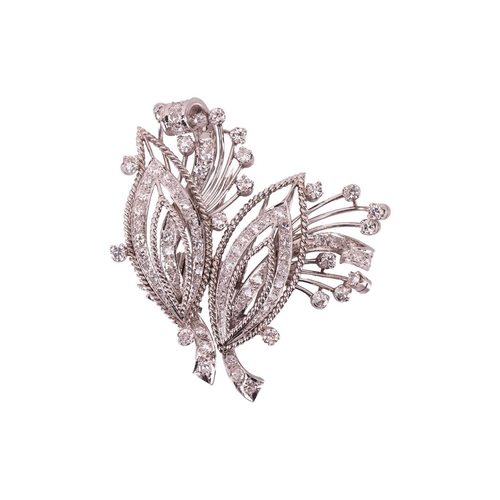 33 - A diamond convertible double-clip spray brooch, each clip with a navette-shaped motif and spray, set... 