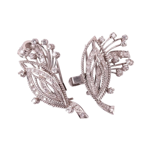 33 - A diamond convertible double-clip spray brooch, each clip with a navette-shaped motif and spray, set... 