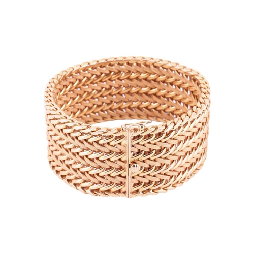 35 - A wide woven link bracelet, flat with textured details, completed with a concealed push button clasp... 