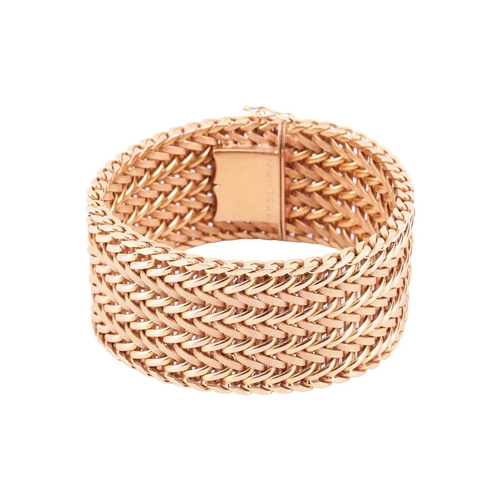 35 - A wide woven link bracelet, flat with textured details, completed with a concealed push button clasp... 