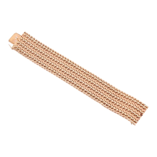 35 - A wide woven link bracelet, flat with textured details, completed with a concealed push button clasp... 