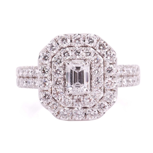 36 - A laboratory-grown diamond cluster ring, featuring an emerald-cut laboratory-grown diamond measuring... 