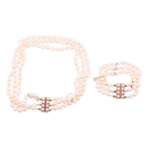 42 - A three-strand pearl choker necklace and matching bracelet, the cultured pearls of cream body colour... 