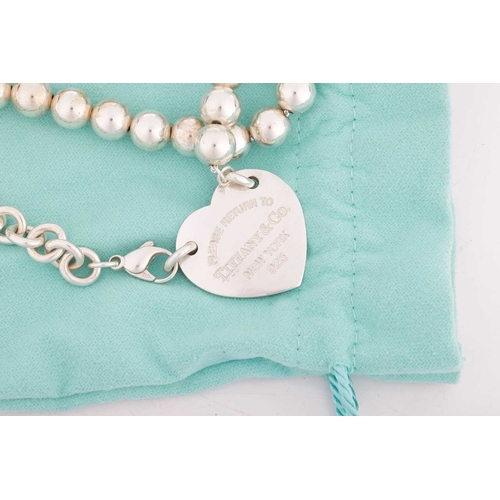 46 - Tiffany - A 'Return to Tiffany' silver tag necklace, the heart shape panel inscribed 'Please return ... 