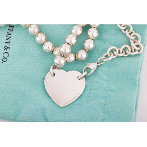 46 - Tiffany - A 'Return to Tiffany' silver tag necklace, the heart shape panel inscribed 'Please return ... 