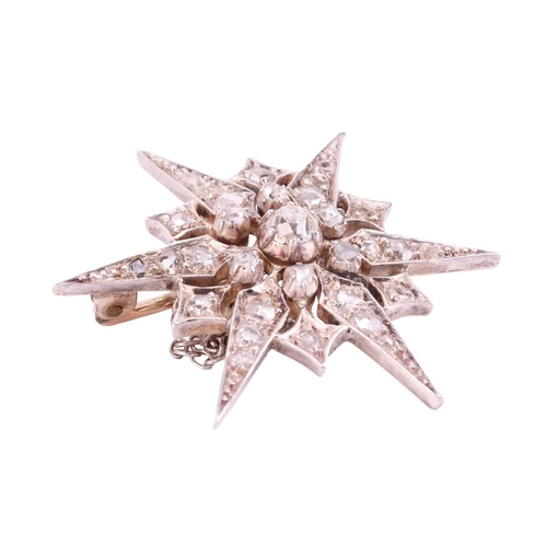 48 - A Victorian star brooch, set throughout with diamonds, the largest central old-cut diamond measuring... 