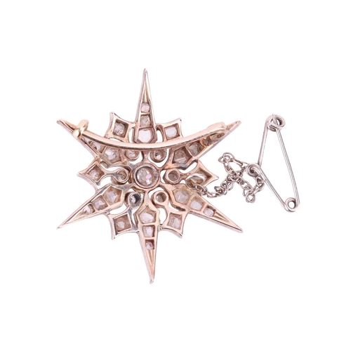 48 - A Victorian star brooch, set throughout with diamonds, the largest central old-cut diamond measuring... 