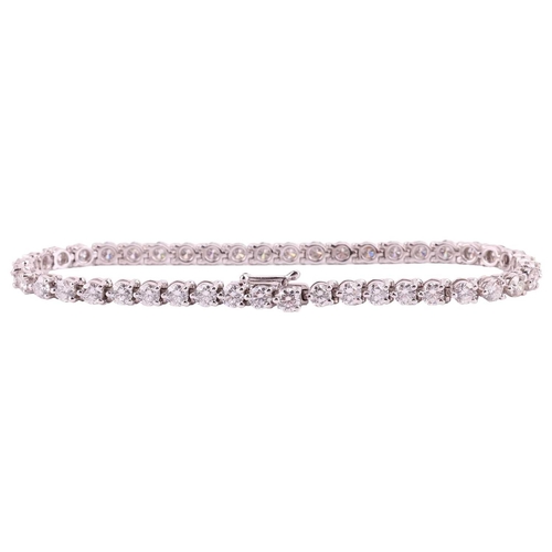 50 - A diamond line bracelet by David Morris, claw set with 44 round brilliant diamonds measuring approxi... 