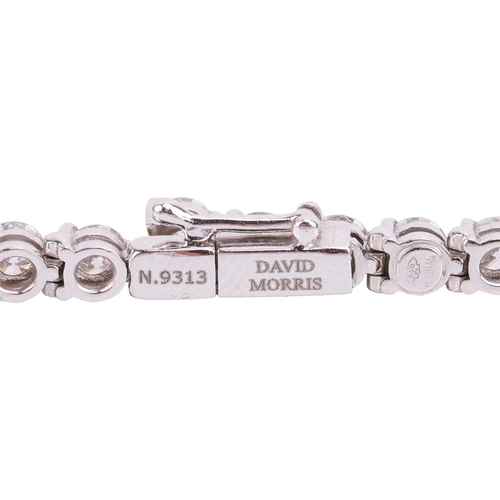 50 - A diamond line bracelet by David Morris, claw set with 44 round brilliant diamonds measuring approxi... 