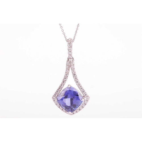 51 - A tanzanite and diamond-set drop pendant, featuring a cushion-cut tanzanite measuring approximately ... 