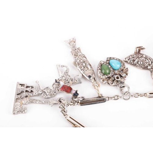 52 - An Art Deco gem-set charm bracelet, two signed Cartier; composed of a series of cable and bar links,... 