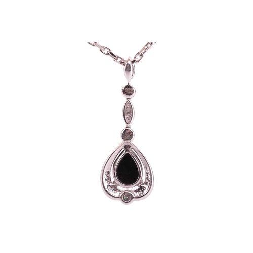 55 - A jet and diamond-set drop pendant, the pear-shaped jet cabochon in a diamond-set mount with millegr... 