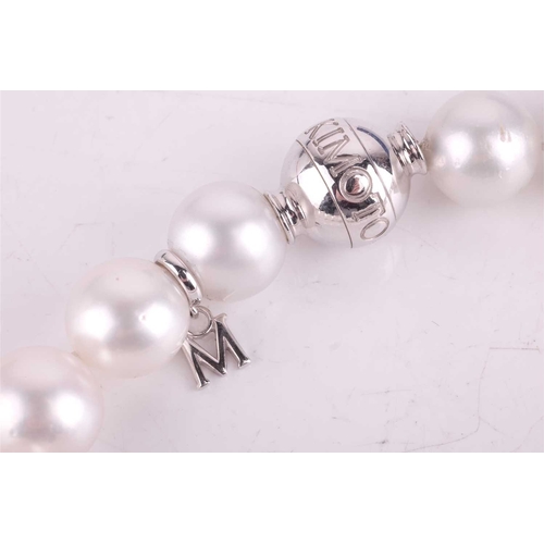 59 - Mikimoto - a single-strand South Sea pearl with a diamond-set clasp, comprising a row of graduated p... 