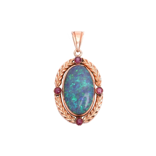 6 - An opal and ruby pendant, featuring a large oval cabochon of a precious opal of 2.4 x 1.5 cm, displa... 