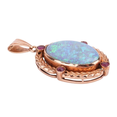 6 - An opal and ruby pendant, featuring a large oval cabochon of a precious opal of 2.4 x 1.5 cm, displa... 