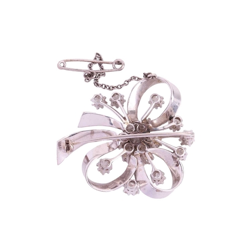 61 - A diamond-set spray brooch, of floral and ribbon design, set with sixteen old-cut diamonds, with a t... 