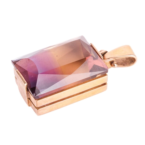 65 - An ametrine pendant, featuring a faceted ametrine measuring approximately 23mm x 16.5mm, in a geomet... 