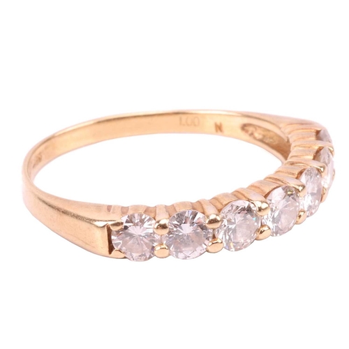 68 - A seven-stone diamond half-hoop ring in 18ct yellow gold, set with a row of slightly graduated brill... 