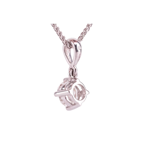 75 - A diamond solitaire pendant, featuring a round brilliant diamond, with an estimated carat weight of ... 