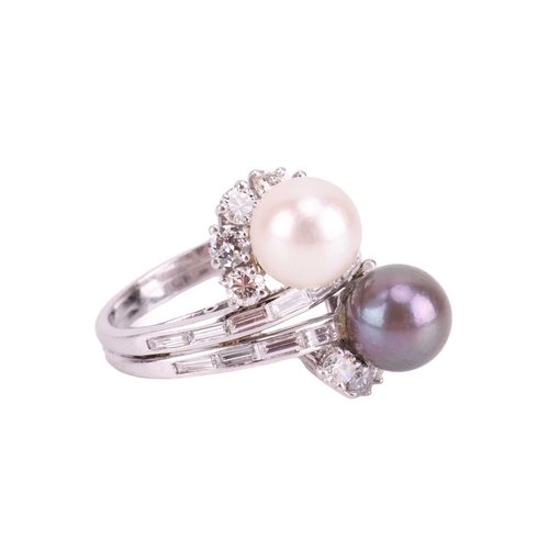 83 - A cultured pearl and diamond cross-over ring, featuring a white cultured pearl with silver overtones... 